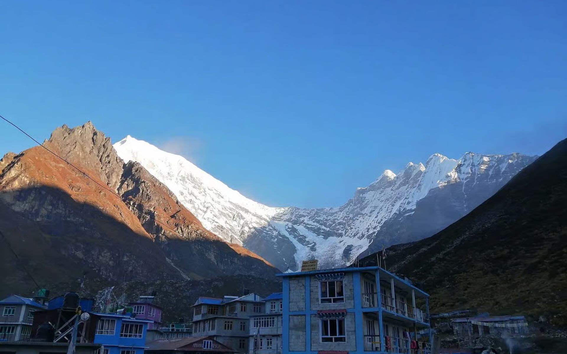Village of Kyanjin Gompa (elevation around 3,850 meters) in the Langtang Valley, Nepal, with the snow-capped peak of Langtang