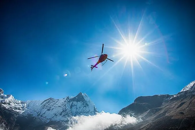 Photo 2: heli flying above annapurna base camp 1786276818715 np85dg